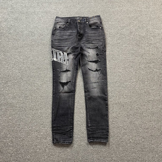 AMIRI VARSITY LOGO REPAIR JEANS