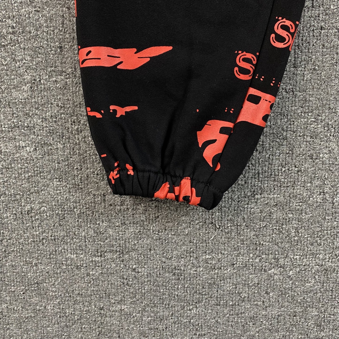 SP5DER SEX AOP SWEATPANTS BLACK