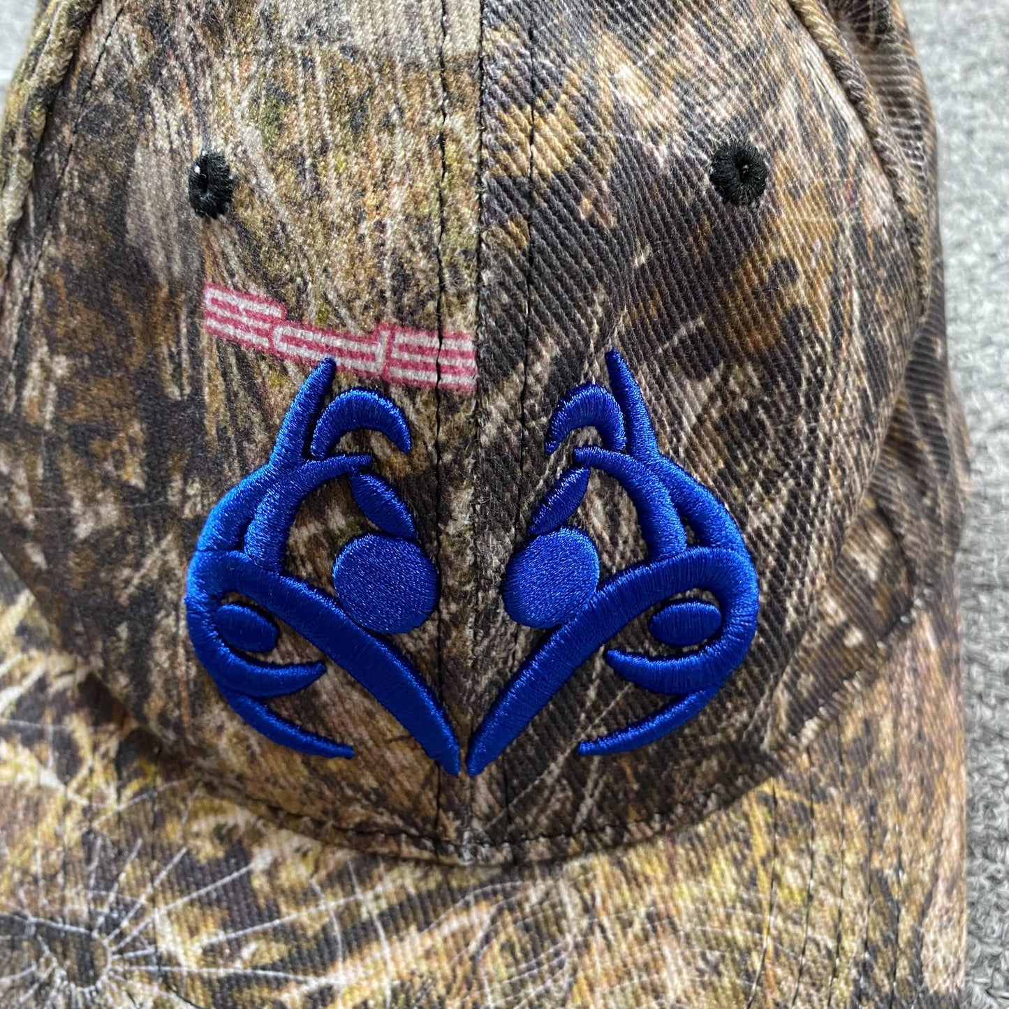 SP5DER BLUE LOGO CAP REAL TREE CAMO